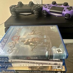 Sony PS4 Slim Console with Black and Purple DualShock Controllers and Game Stack